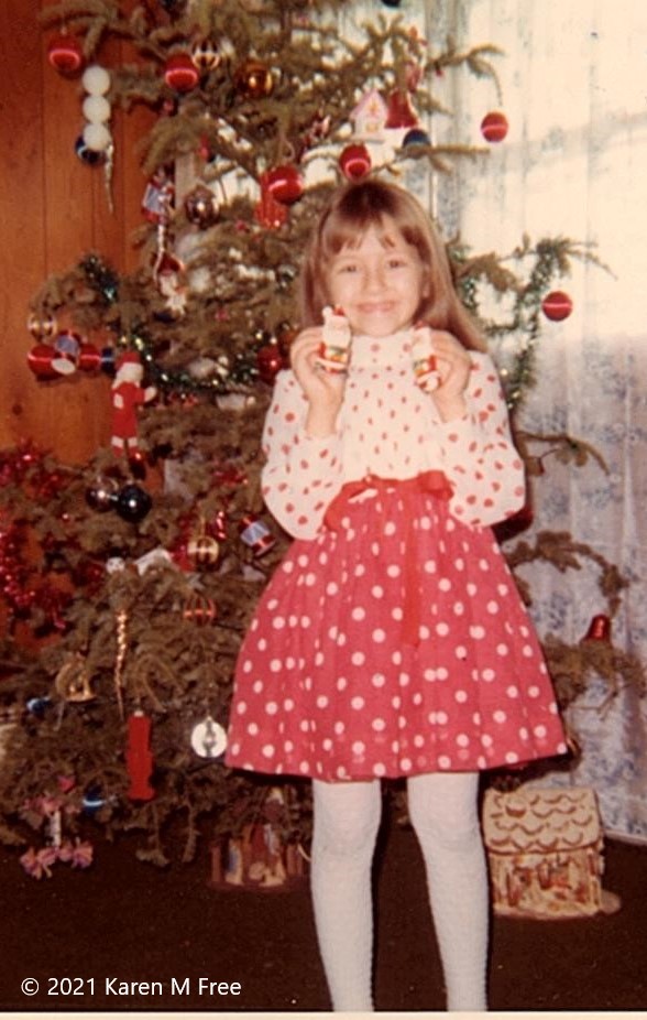 Young girl in polka dot skirt and blouse.