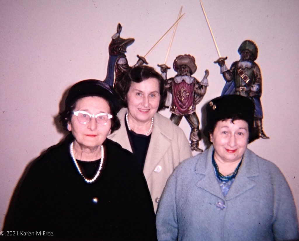 3 sisters in front of Three Musketeers wall art