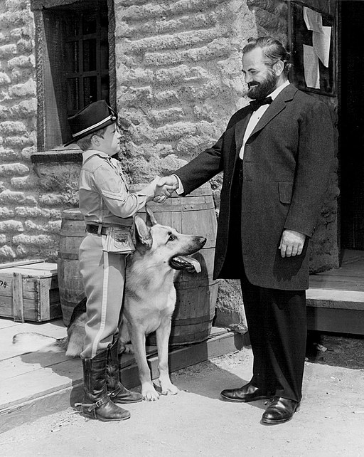 From the Adventures of Rin-Tin-Tin, Paul Birth as President Grant, Lee Aker as Rusty and Rin-Tin-Tin. Rusty is shaking President Grant's hand.